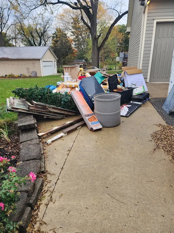 Dumpster being loaded with debris for 30 Yard Dumpster Rental in Crownpoint